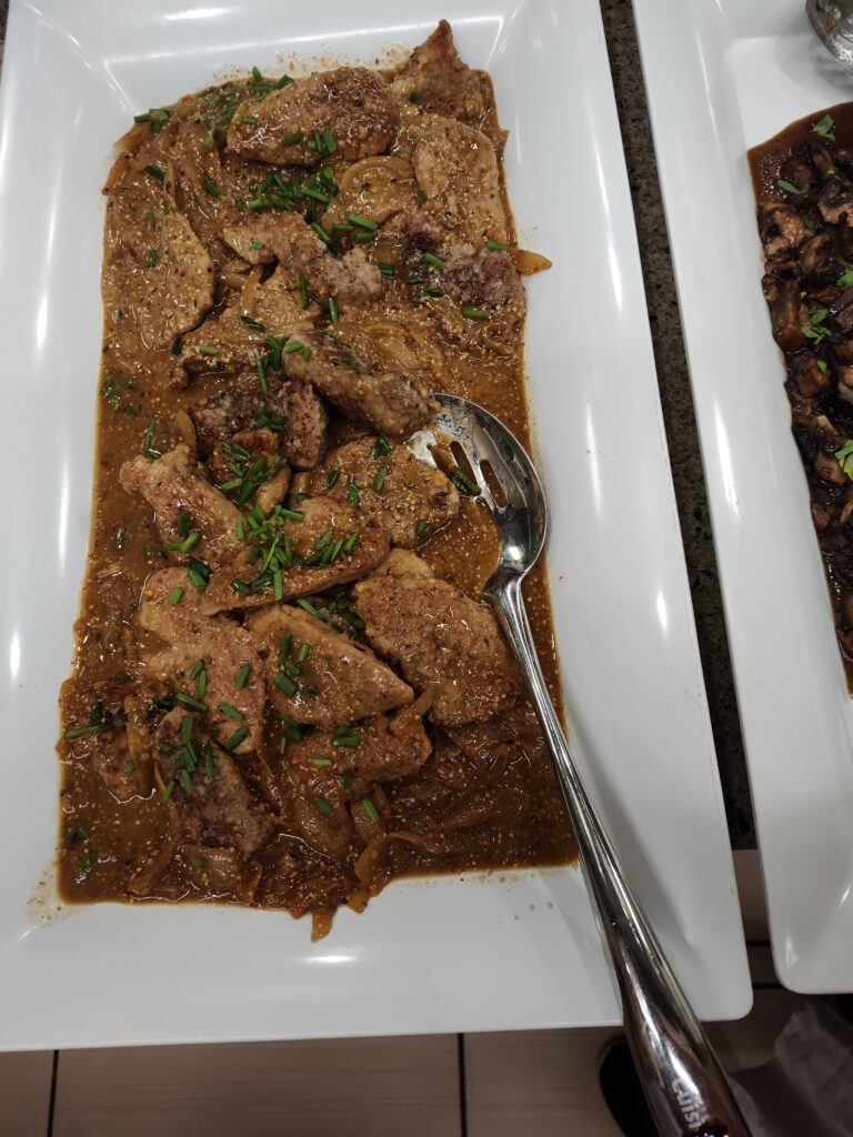 Seared Sliced Pork Tenderloin with Caramelized Onions and Gravy